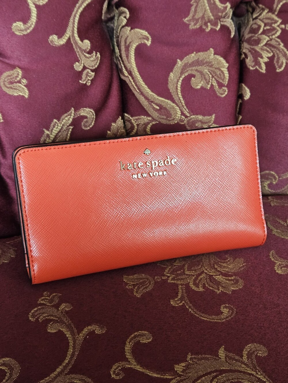 Kate Spade New York coral orange Saffiano leather continental wallet